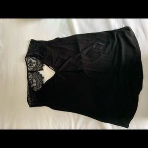 Black sleeveless lace back top by Daniel Rainn